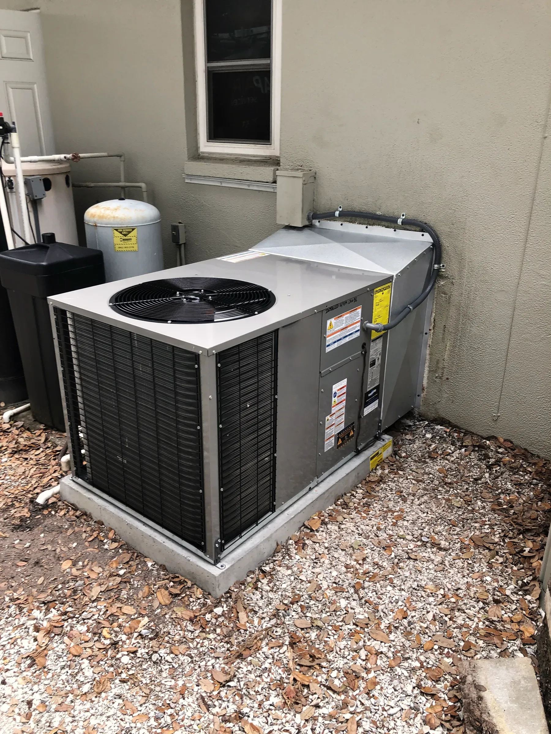 A Legacy-installed outdoor air-conditioning condenser at a Tampa Bay home